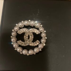 Beautiful brooch with logo
